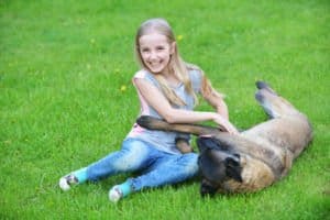 Girl Playing with Belgian Malinois