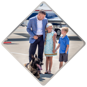 protection dog with family on private airstrip
